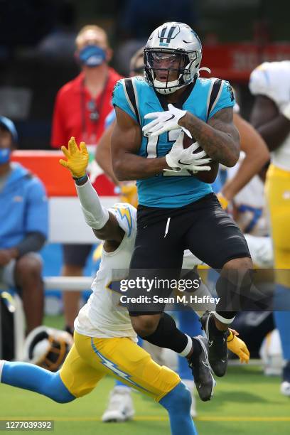 Moore of the Carolina Panthers makes a catch on a pass play past the defense of Michael Davis of the Los Angeles Chargers during the second half of a...
