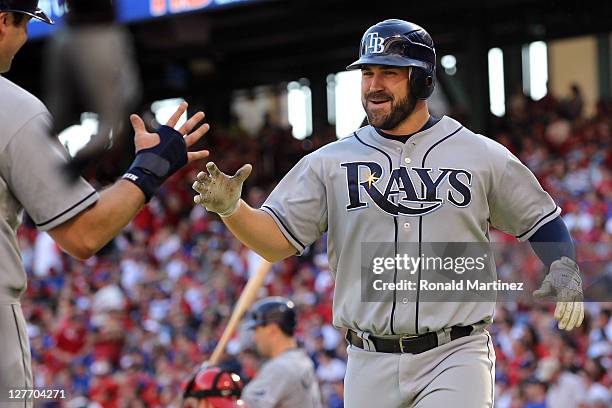 Kelly Shoppach of the Tampa Bay Rays is greeted as he heads toward the dugout after hitting a three-run home run in the in the third inning off...