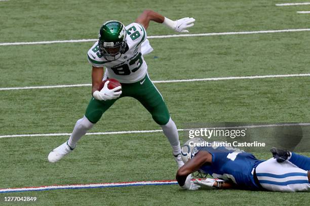 Josh Malone of the New York Jets is tripped up by T.J. Carrie of the Indianapolis Colts during the first quarter at Lucas Oil Stadium on September...