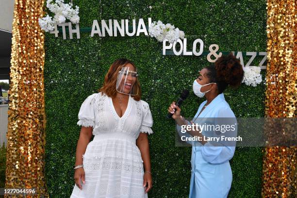 Charisse Jordan of Real Housewives of Potomac is interviewed by Bblue carpet media host Ambreia Williams at Grandiosity Events 4th annual Polo & Jazz...