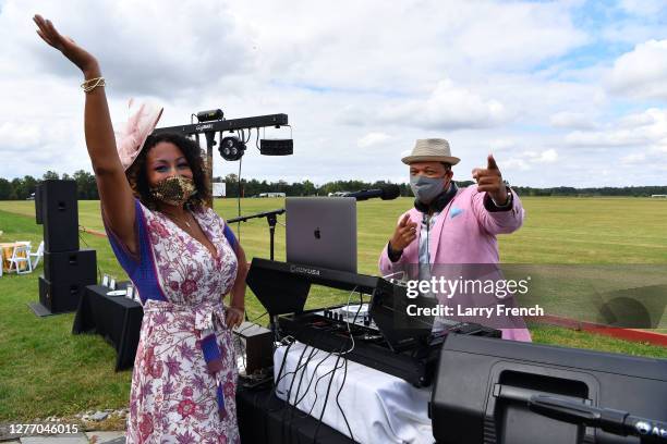 Susan Smallwood, producer of Grandiosity Events Cigars & Guitars Charity Polo & Jazz charity event and DJ V appear at Grandiosity Events 4th annual...