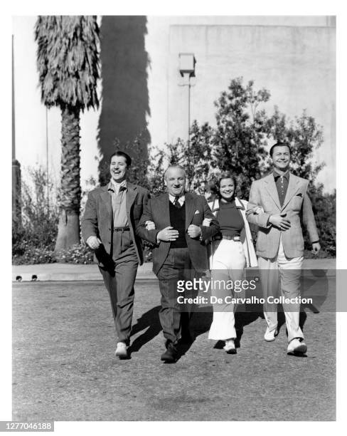 Actor Don Ameche , Director Allan Dwan , French Actress Simone Simon and Actor Robert Young going out to have lunch during the filming of the comedy...