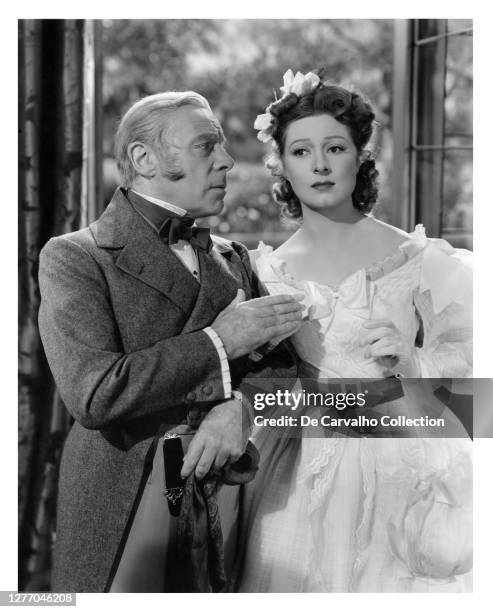 British Actor Edmund Gwenn as ‘Mr Bennett’ and British Actress Greer Garson as ‘Elizabeth Bennet’ in a scene from the movie 'Pride and Prejudice'...