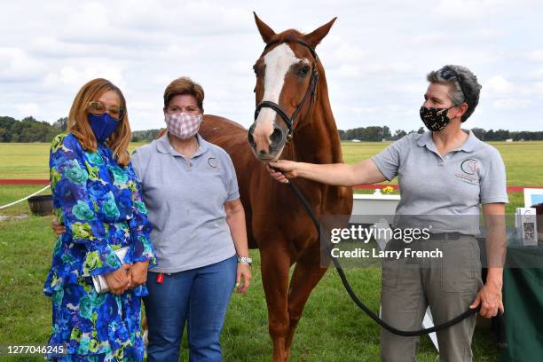 Christin Hutchinson, and Carolyn Jackson and Lesley Shear, both of Circle of Hope Therapeutic Riding appear at Grandiosity Events 4th annual Polo &...
