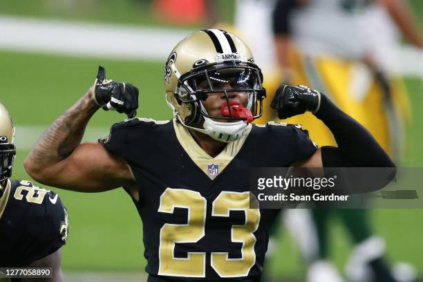 Marshon Lattimore of the New Orleans Saints celebrates after stopping Aaron Jones of the Green Bay Packers on fourth down during the second half at...
