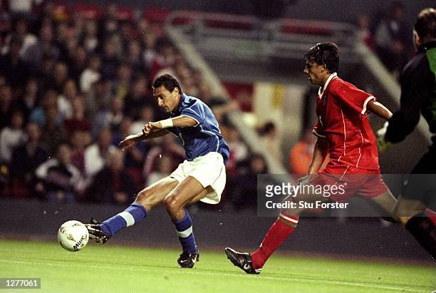 Diego Fuser scores Italy's first goal after a mistake by Chris Coleman of Wales during the European Championship qualifier at Anfield in Liverpool,...