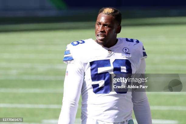 Aldon Smith of the Dallas Cowboys looks on in the second quarter against the Seattle Seahawks at CenturyLink Field on September 27, 2020 in Seattle,...