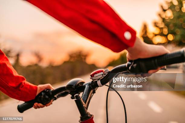 hands on bicycle steering wheel - hands steering wheel stock pictures, royalty-free photos & images