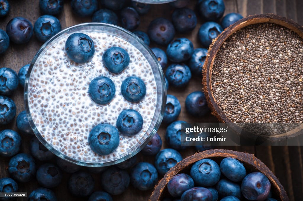 Chia Pudding, blackberry in coconut shell
