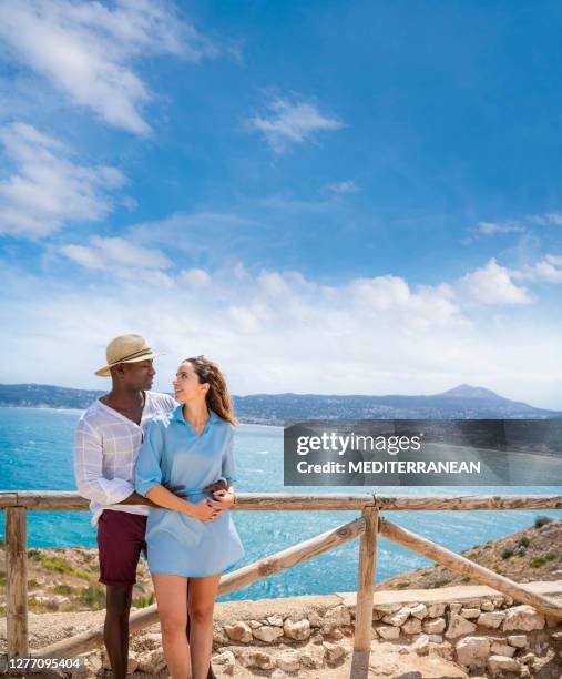 tourist couple hug in mediterranean lookout of spain - javea stock pictures, royalty-free photos & images