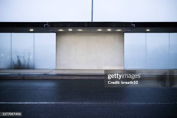 front view blank cement and frosted glass wall at outdoor - billboard wall stock pictures, royalty-free photos & images