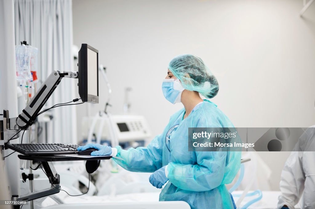 Nurse Using Computer in COVID-19 Ward