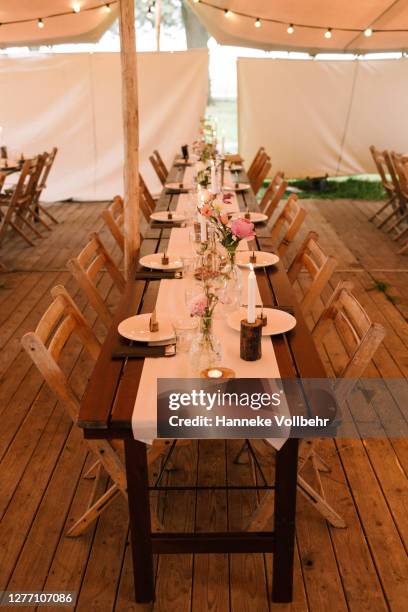 festive table setting in a party tent on a wedding - wedding table setting imagens e fotografias de stock