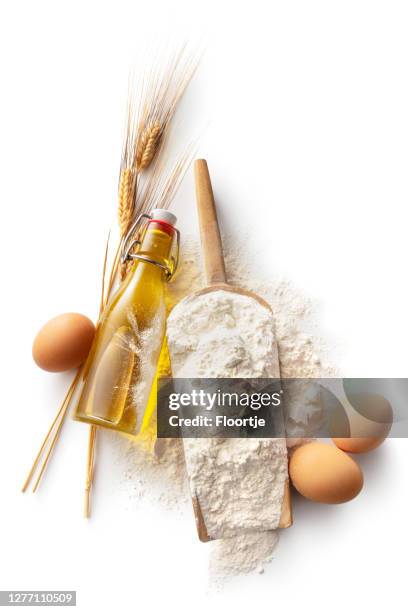 baking: flour, olive oil, eggs and wheat isolated on white background - wheat flour stock pictures, royalty-free photos & images