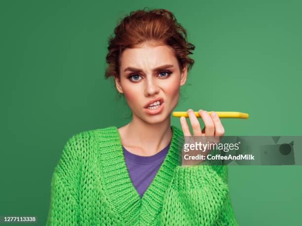 attractive young girl talking with her boyfriend - microphone mouth stock pictures, royalty-free photos & images