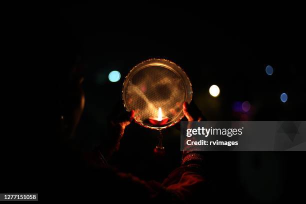 celebrating karva chauth at night - fasting stock pictures, royalty-free photos & images