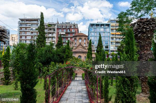 greece, central macedonia, thessaloniki, footpath across garden of church of panagia chalkeon - thessaloniki stock pictures, royalty-free photos & images