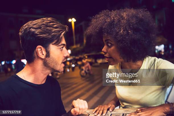 close-up of angry couple arguing at date night - arguing blacks stock pictures, royalty-free photos & images