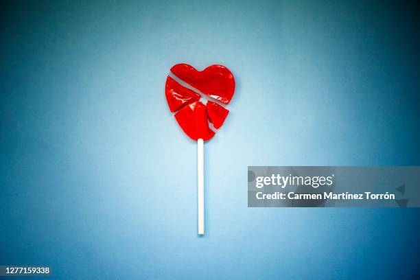 broken heart shape lollipop - frustration concept stock pictures, royalty-free photos & images