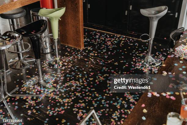 confetti on floor at home after party - morning after party stock pictures, royalty-free photos & images