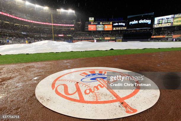 The New York Yankees log is seen during a rain delay during Game One of the American League Division Series at Yankee Stadium on September 30, 2011...