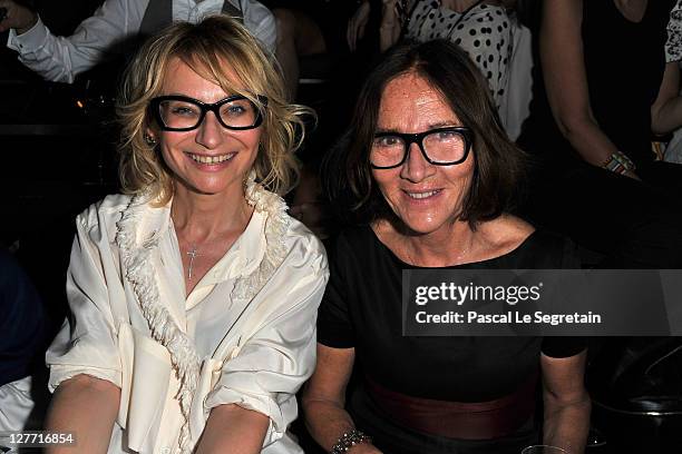 Evelina Khromchenko and guest attend the Lanvin Ready to Wear Spring / Summer 2012 show during Paris Fashion Week at Jardin des Tuileries on...