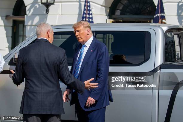 President Donald Trump chats with Steve Burns Lordstown Motors CEO about the new Endurance all-electric pickup truck on the south lawn of the White...
