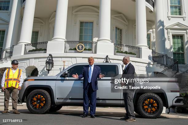 President Donald Trump chats with Steve Burns Lordstown Motors CEO about the new Endurance all-electric pickup truck on the south lawn of the White...