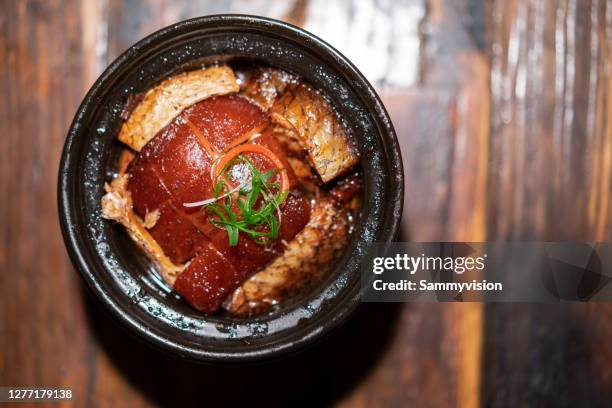 close-up of dongpo pork on wooden table - braised stock pictures, royalty-free photos & images