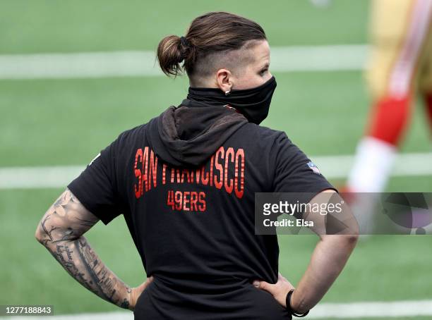 Offensive assistant Katie Sowers of the San Francisco 49ers watches her players during warm ups before the game against the New York Giants at...