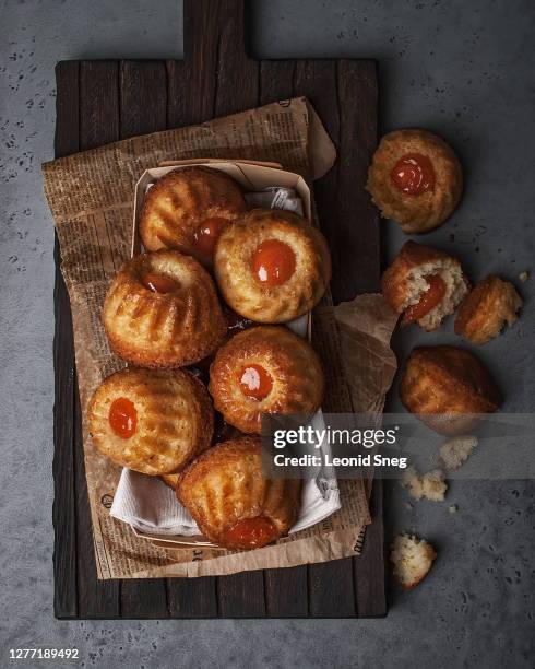 food photography of confectionery cake with jam and ingredients on a gray textured concrete background top view - aprikossylt bildbanksfoton och bilder