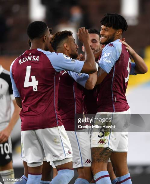 Tyrone Mings of Aston Villa celebrates with teammates after scoring his team's third goal during the Premier League match between Fulham and Aston...