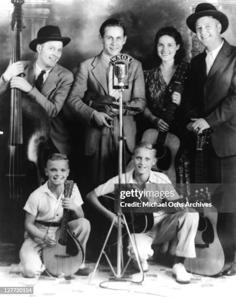 Country singer Johnny Wright and the Tennessee Hillbillies (L-R Unidentified, Chet Atkins, Kitty Wells, and Johnny Wright pose for a portrait circa...