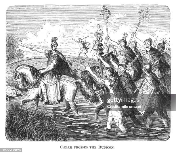 old engraved illustration of gaius julius caesar crosses the rubicon - cäsar stock-fotos und bilder