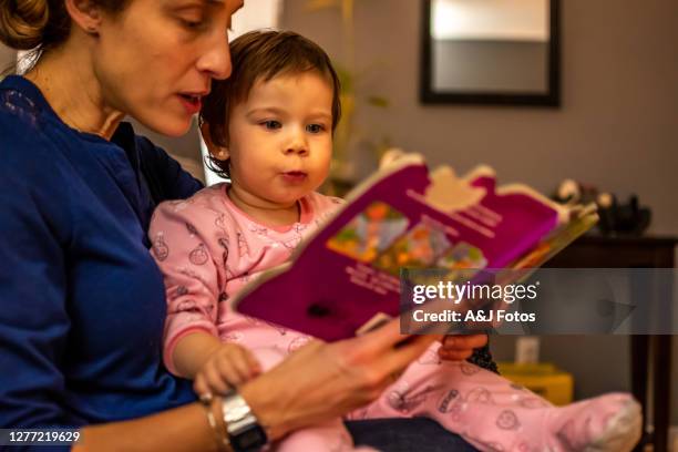 toddler celebrating christmas. - godparent stock pictures, royalty-free photos & images