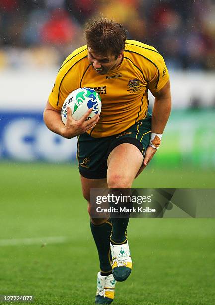 Drew Mitchell of the Wallabies pulls up injured during the IRB 2011 Rugby World Cup Pool C match between Australia and Russia at Trafalgar Park on...