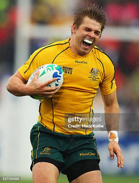 Drew Mitchell of the Wallabies pulls up injured during the IRB 2011 Rugby World Cup Pool C match between Australia and Russia at Trafalgar Park on...