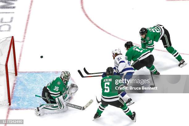 Brayden Point of the Tampa Bay Lightning scores a goal past Anton Khudobin of the Dallas Stars during the first period in Game Six of the 2020 NHL...