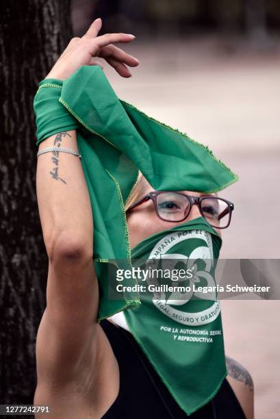 Demonstrator wearing a green handkerchief takes part during a demonstration in favor of decriminalization of abortion on the International Safe...