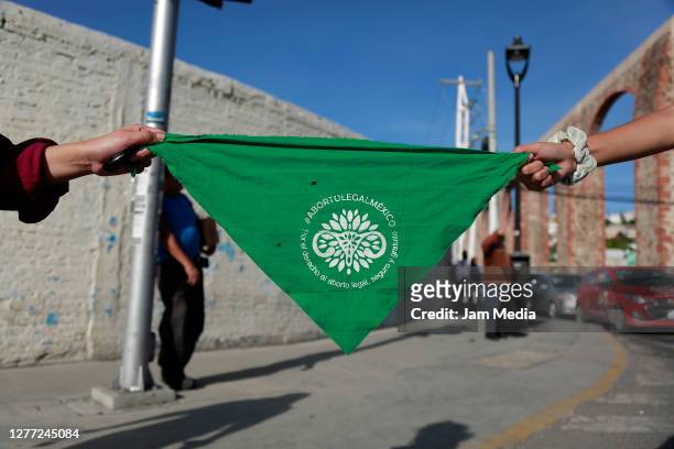 Demonstrators show their handkerchiefs during a demonstration in favor of decriminalization of abortion on the International Safe Abortion Day on...