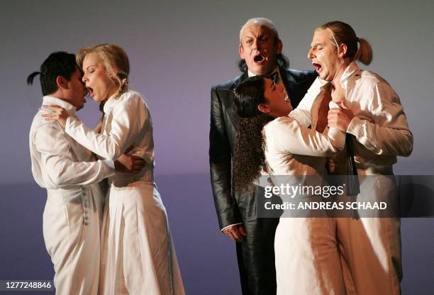 Opera singers Saimir Pirgu as Ferrando, Elina Garanca as Dorabella, Thomas Allen as Don Alfonso, Tamar Iveri as Fiordiligi and Nicolas Uivieri as...