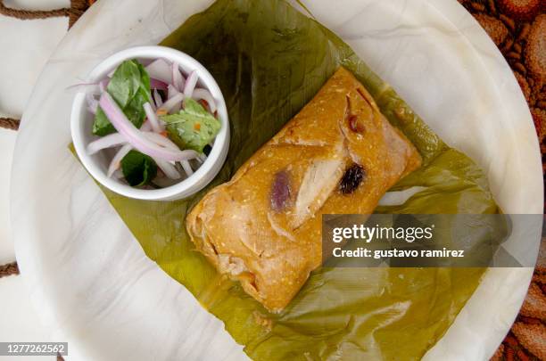 tamale with salad - south american culture stock pictures, royalty-free photos & images