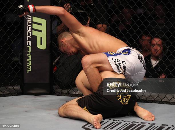 Nate Diaz punches down at Takanori Gomi on the ground during the UFC 135 event at the Pepsi Center on September 24, 2011 in Denver, Colorado.