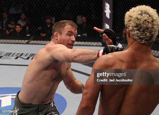 Matt Hughes punches Josh Koscheck during the UFC 135 event at the Pepsi Center on September 24, 2011 in Denver, Colorado.