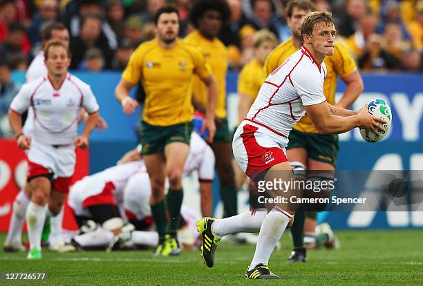 Yury Kushnarev of Russia prepares to dispatch the pass during the IRB 2011 Rugby World Cup Pool C match between Australia and Russia at Trafalgar...