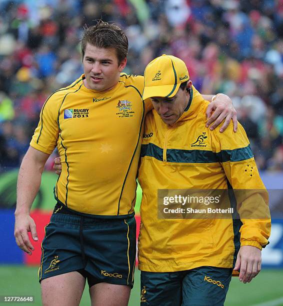 Drew Mitchell of Australia leaves the field injured during the IRB 2011 Rugby World Cup Pool C match between Australia and Russia at Trafalgar Park...