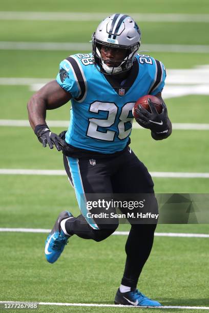 Mike Davis of the Carolina Panthers runs the ball during the first half of a game against the Los Angeles Chargers at SoFi Stadium on September 27,...