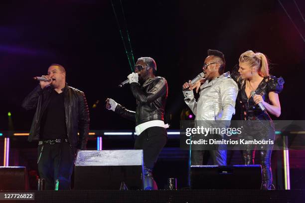 Dante Santiago and will.i.am, apl.de.ap, and Fergie of The Black Eyed Peas perform onstage during CHASE Presents The Black Eyed Peas and Friends...