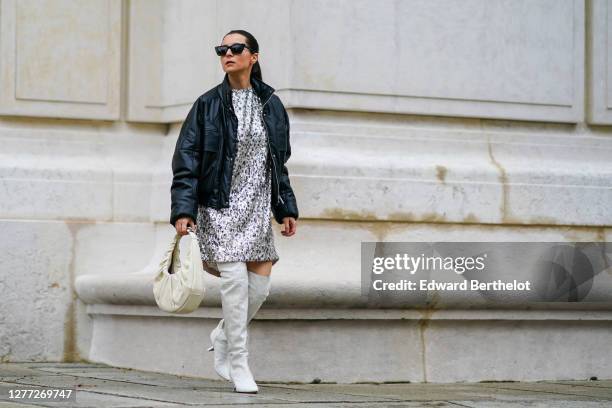 Julia Comil wears a silver shiny sequin dress from "In the Mood for Love", white over the knee pointy boots from Nicholas Kirkwood, a Barbara Bui...