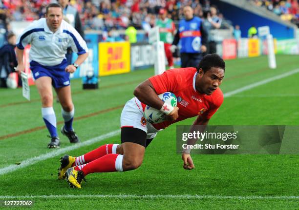 Wing Sukanaivalu Hufanga of Tonga dives over to score the opening try during the IRB 2011 Rugby World Cup Pool A match between France and Tonga at...